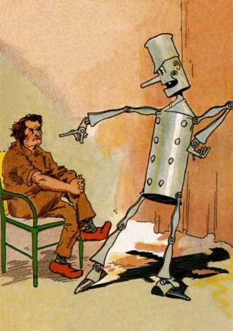 The Tin Soldier is pointing in
shock at Chopfyt, who is sitting in a chair, looking more annoyed than
anything else.  Chopfyt has reddish-brown hair, a scowling face, and a
hooked nose.  He is wearing rumpled brown cloths, and red shoes with
large toes. His hands are clasped around his right knee.  He appears
to be very uncomfortable with the situation but determined to ride it
out.  The Tin Soldier looks just like the tin  woodman, except with
two rows of buttons down his
cylindrical body, and instead of the funnel worn by
the Tin Woodman he is wearing a tin shako.