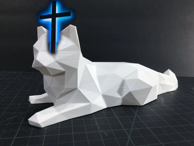A
computer graphics drawing of a roughly cat-shaped polyhedron with a
glowing blue crucifix stuck on its head.