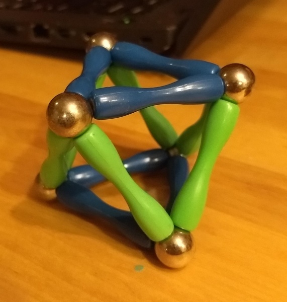 a regular octahedron made of six steel
ball bearings and twelve blue and green magnetic struts