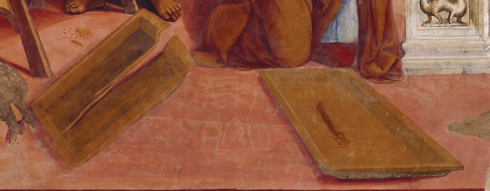 Detail of the painting,
showing just the two piece of the broken colander, lying on the
floor. Each piece is a medium brown color, perhaps made of wood.  The
left piece has a large crack running lengthwise almost the whole way
across.  Both parts are shallow rectangular trays with raised lips
around the edge.  There is a reddish-brown smudge in the right-hand
part.