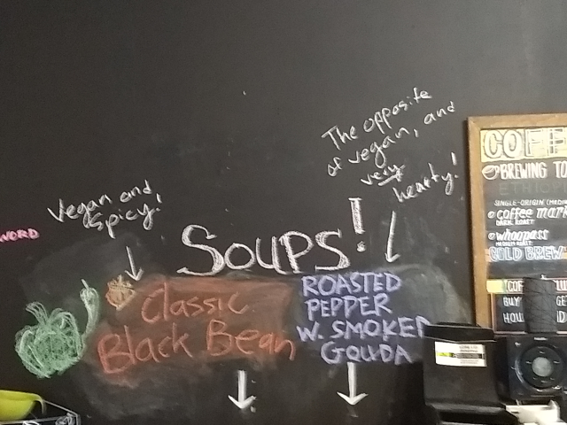 the
blackboard behind the counter of the coffee shop, with menu as
described